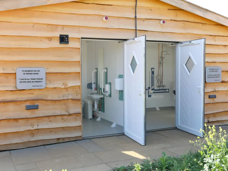 The shower block, with the accessible shower room open