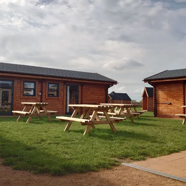 The cabins, with picnic tables outside