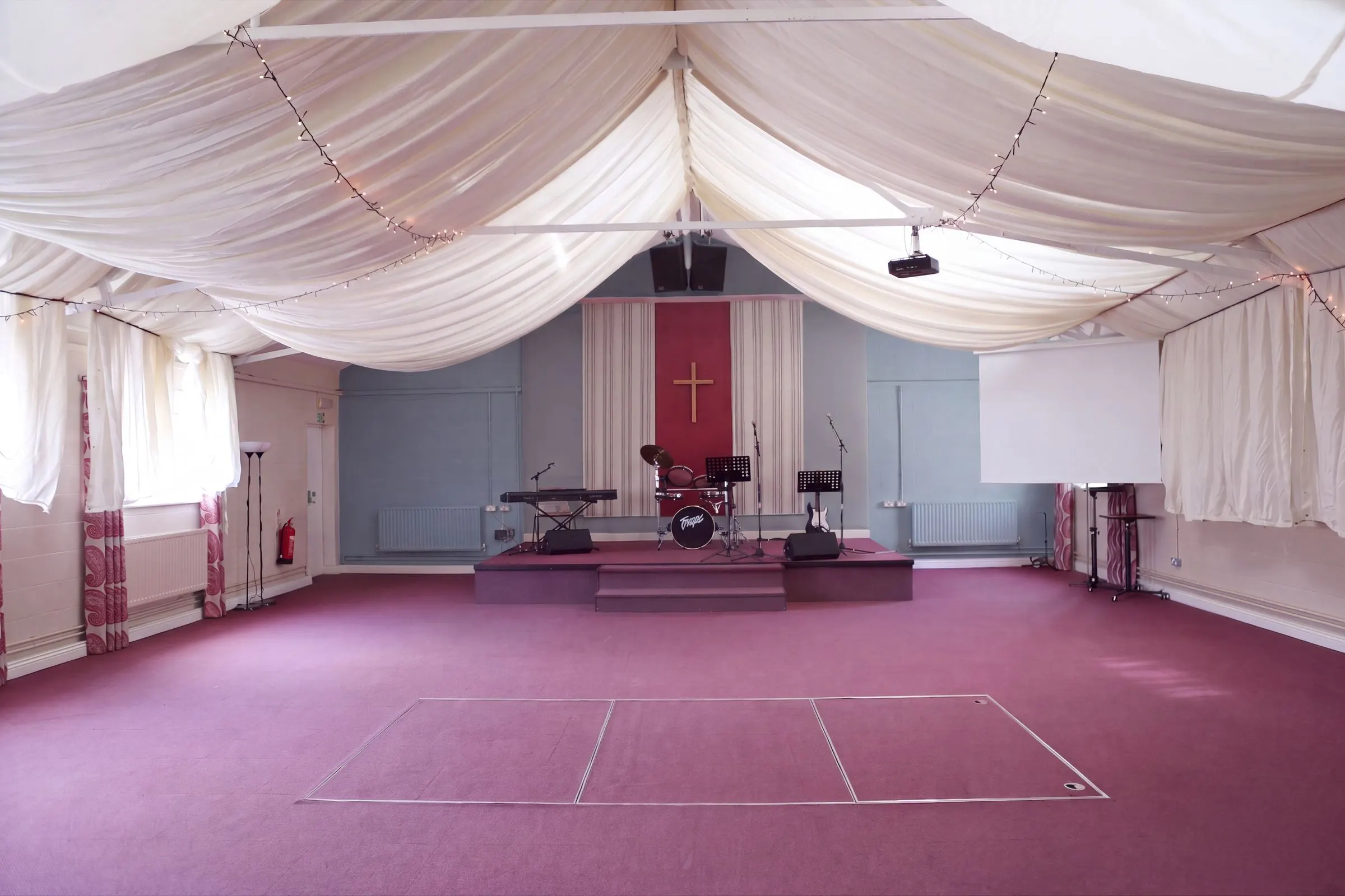 The main hall dressed with drapes for an event
