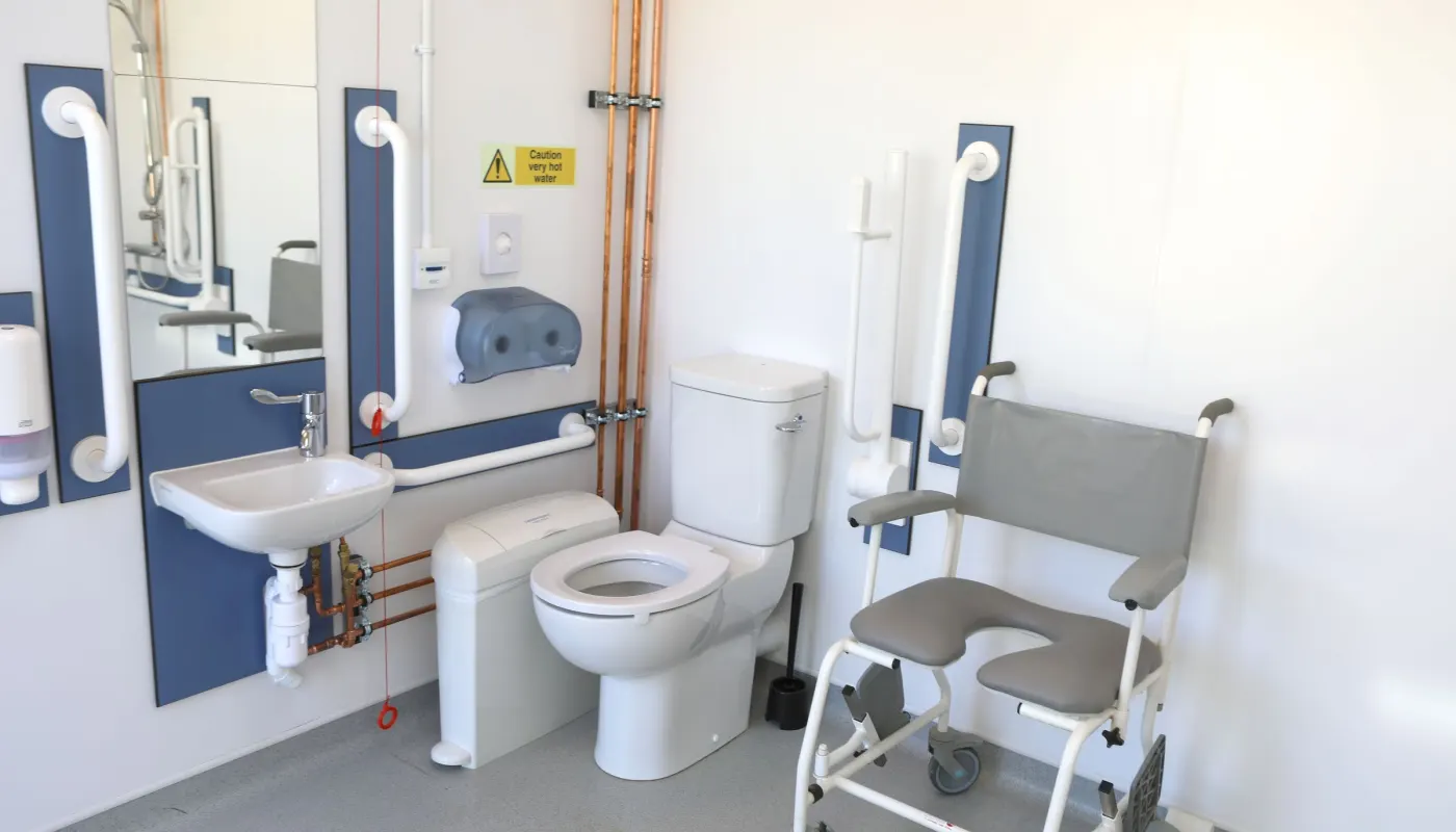 The accessible shower room, with grab rails and a shower chair