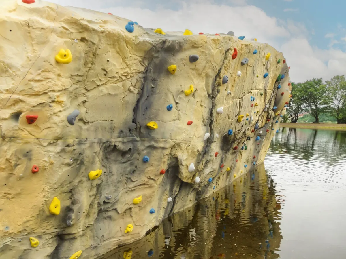 Visualisation of the coasteering wall rising out of The Lake