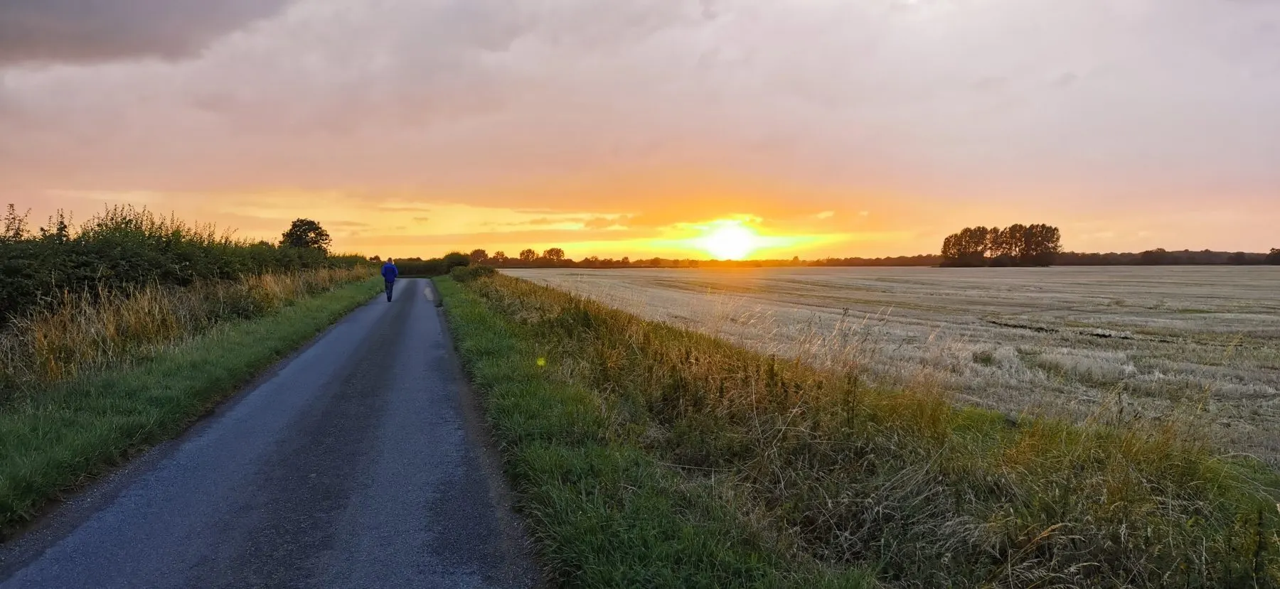 Sunset over the fields at the end of the lane