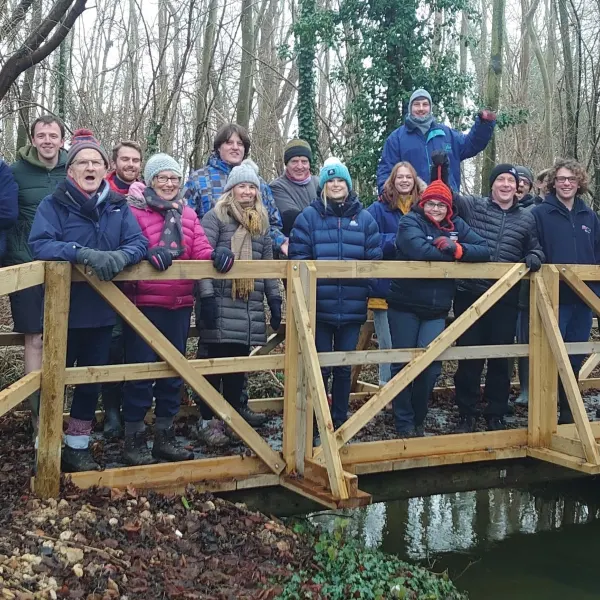 A group on the woodland bridge