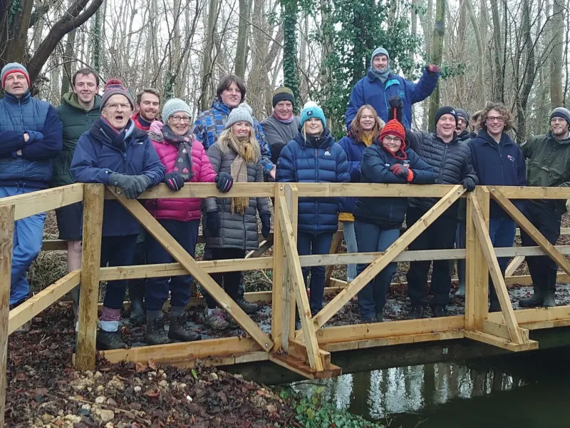 A group on the woodland bridge